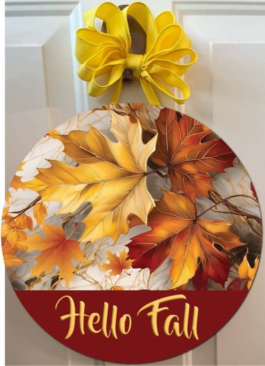 Circular fall-themed decoration with autumn leaves and a yellow bow, saying "Hello Fall."