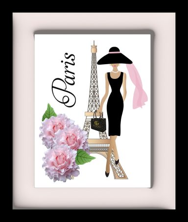 A fashionable woman in a black dress and hat stands by the Eiffel Tower with pink flowers.