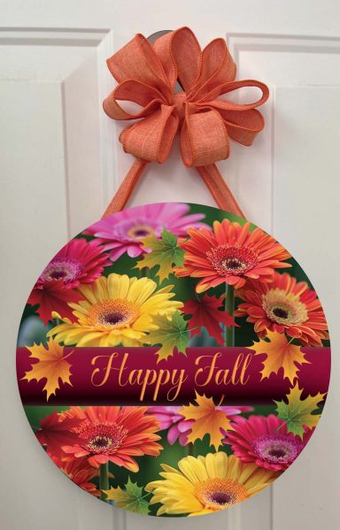 Circular fall wreath with vibrant flowers and a "Happy Fall" message.