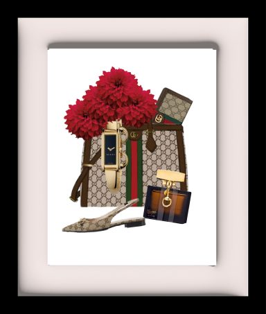 A designer handbag with flowers, sandals, and a perfume bottle arranged stylishly.
