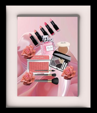 Cosmetics display featuring lipsticks, blush, and makeup brushes with pink roses.